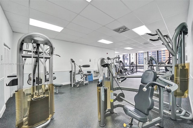 workout area with a paneled ceiling