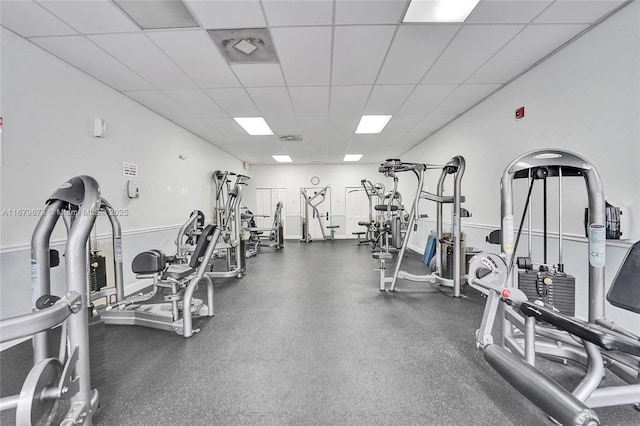 workout area featuring a drop ceiling