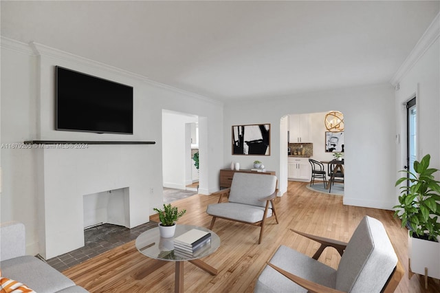 living room featuring ornamental molding and hardwood / wood-style flooring