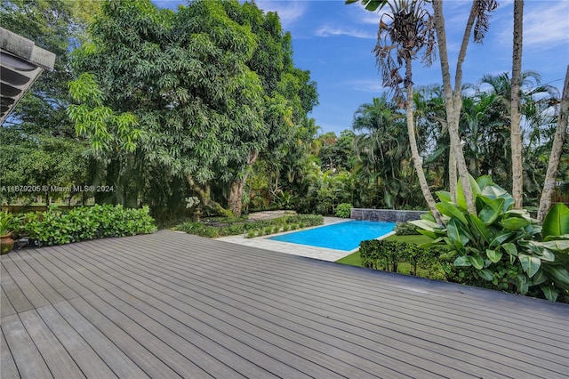 view of pool featuring a wooden deck