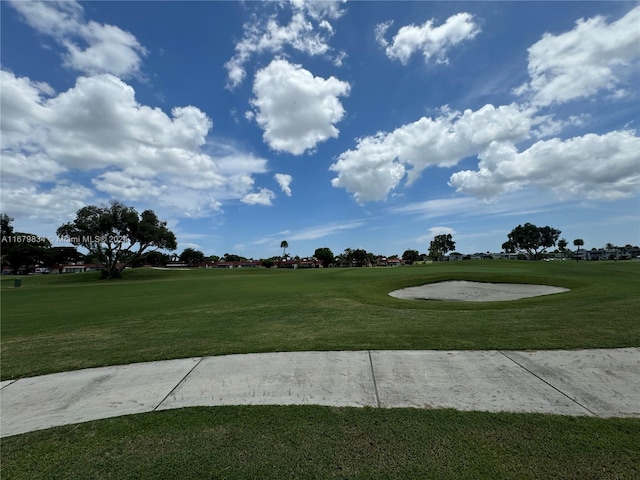 surrounding community featuring a yard