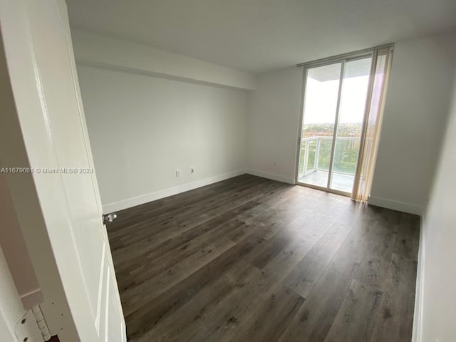 empty room featuring dark hardwood / wood-style floors