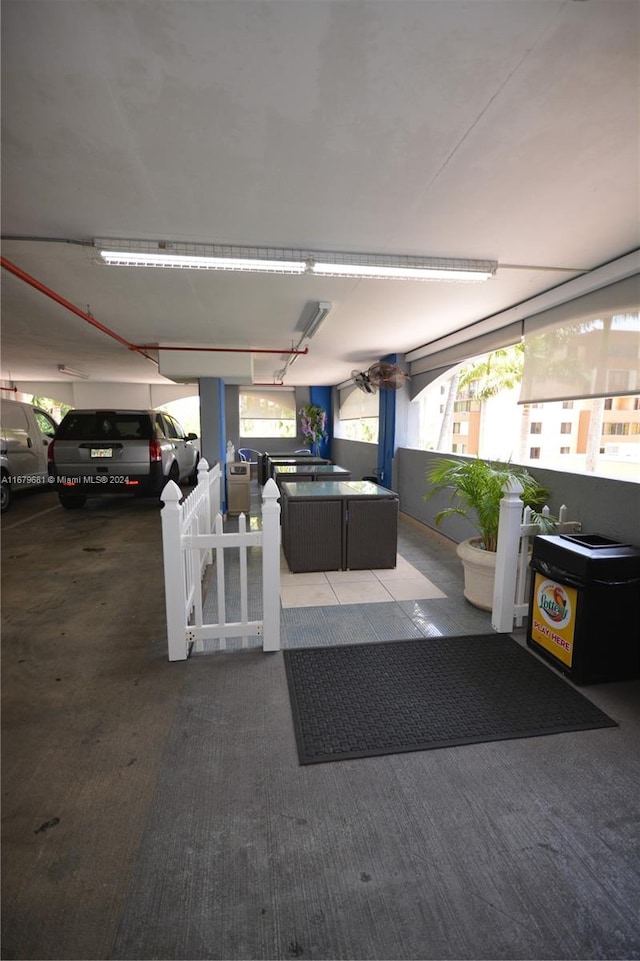 garage featuring a carport