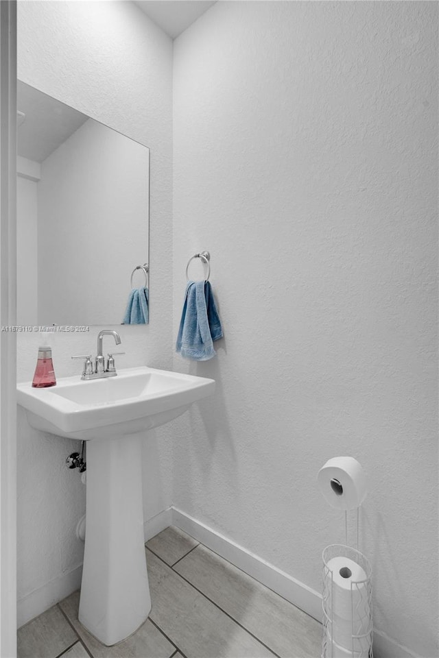 bathroom with tile patterned floors