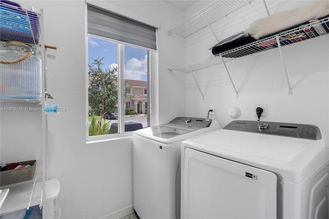 clothes washing area with washer and dryer