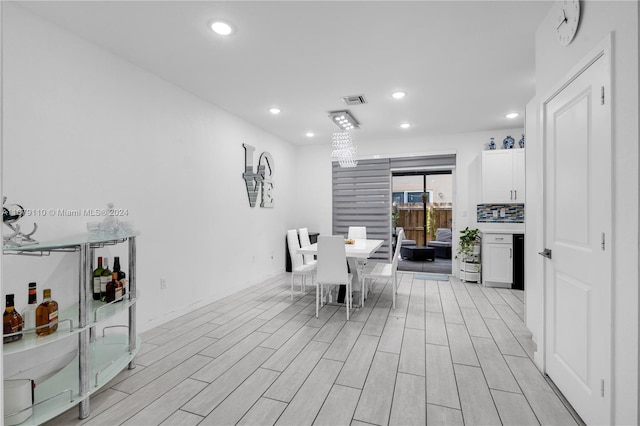 dining space featuring light hardwood / wood-style floors