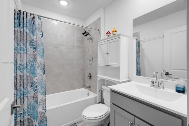 full bathroom featuring vanity, toilet, and shower / tub combo