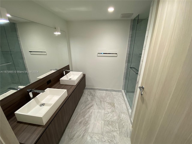 1000 Brickell Plz Unit 2907, Miami, FL 33131 - full bathroom featuring marble look tile flooring, double vanity, a shower stall, and recessed lighting