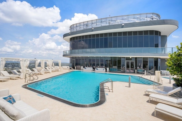 view of pool featuring a patio