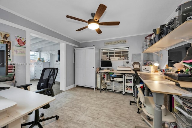 office with crown molding, light wood-type flooring, and ceiling fan