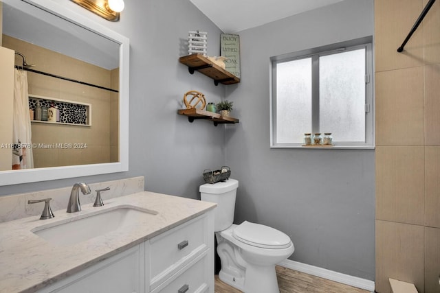 bathroom with toilet, wood-type flooring, a shower with curtain, vaulted ceiling, and vanity