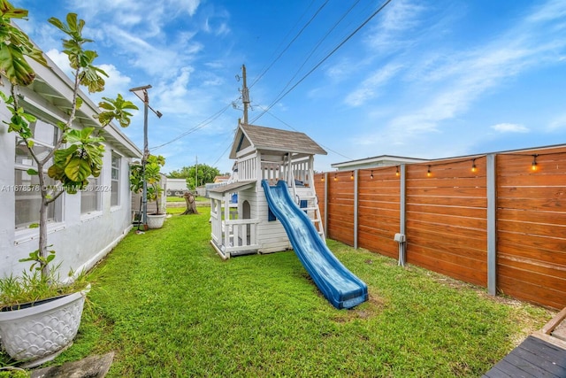 view of playground featuring a lawn