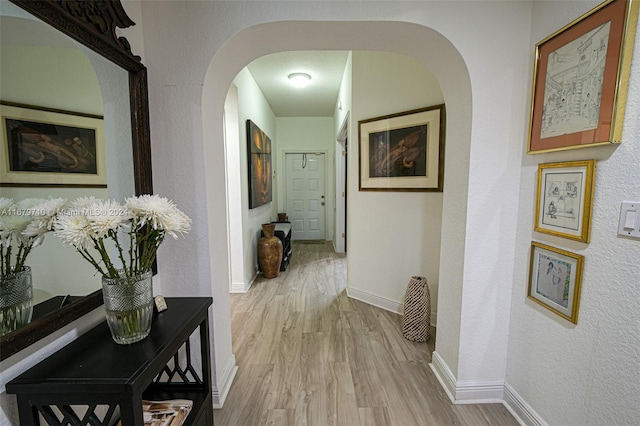 hallway with light wood-type flooring