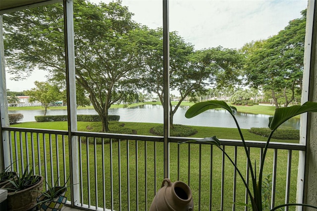 unfurnished sunroom featuring a healthy amount of sunlight and a water view