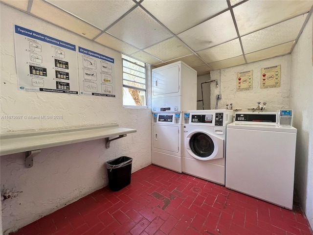 washroom with washer and dryer and stacked washer / dryer