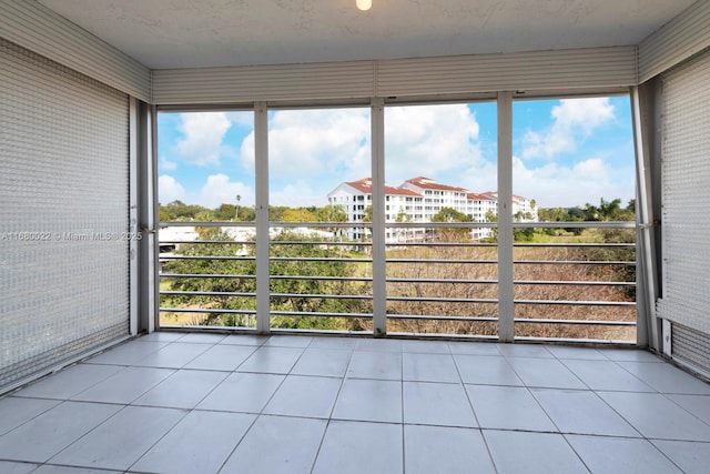 unfurnished sunroom with a healthy amount of sunlight