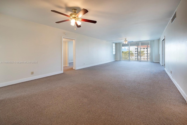 spare room featuring carpet floors and ceiling fan