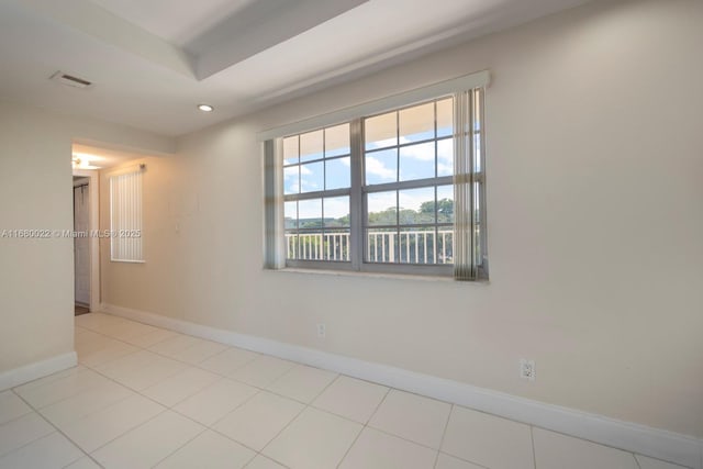 spare room featuring light tile patterned floors