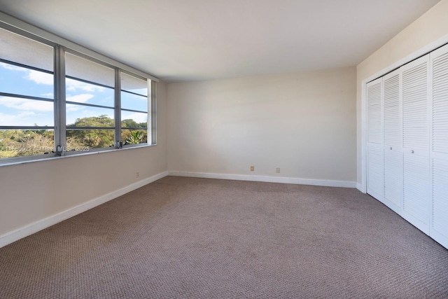 unfurnished bedroom featuring a closet and carpet