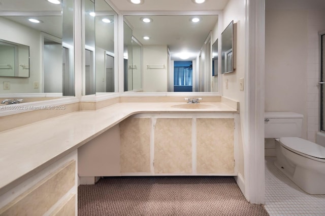 bathroom featuring vanity, tile patterned floors, and toilet