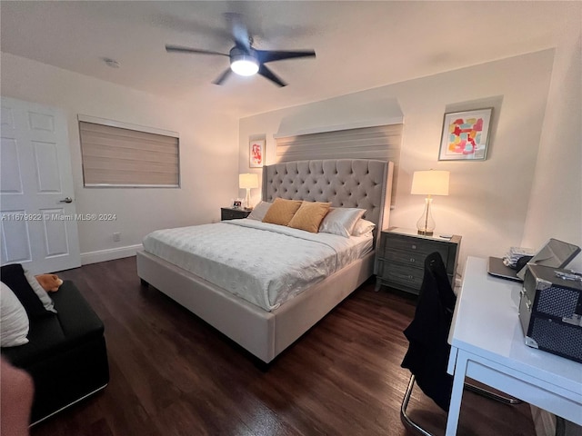 bedroom with dark hardwood / wood-style floors and ceiling fan