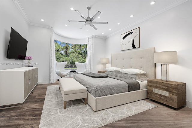 bedroom featuring ornamental molding, hardwood / wood-style flooring, and ceiling fan