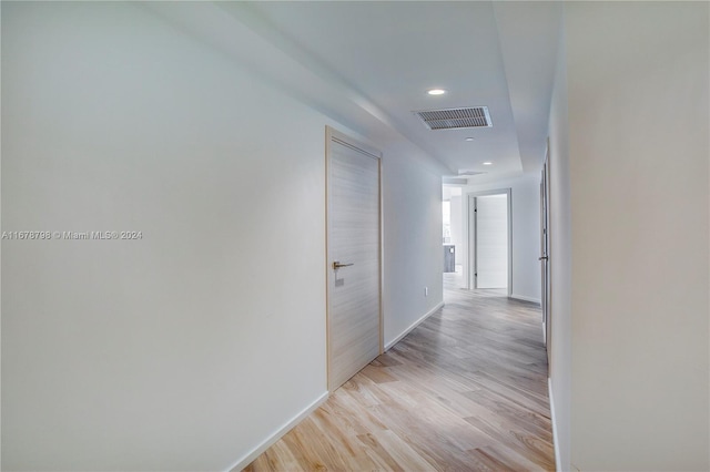 corridor featuring light hardwood / wood-style floors