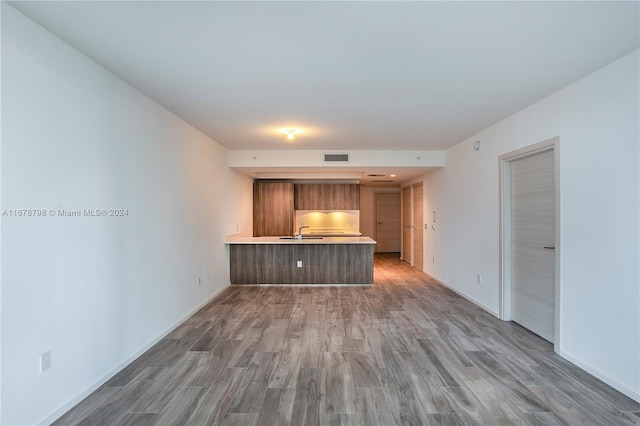 unfurnished living room with dark hardwood / wood-style flooring