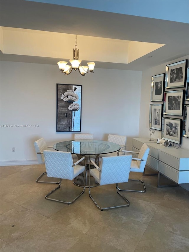 dining space with an inviting chandelier