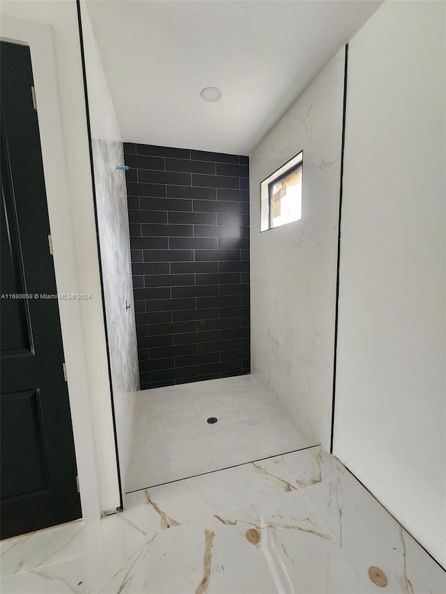 interior space with tiled shower