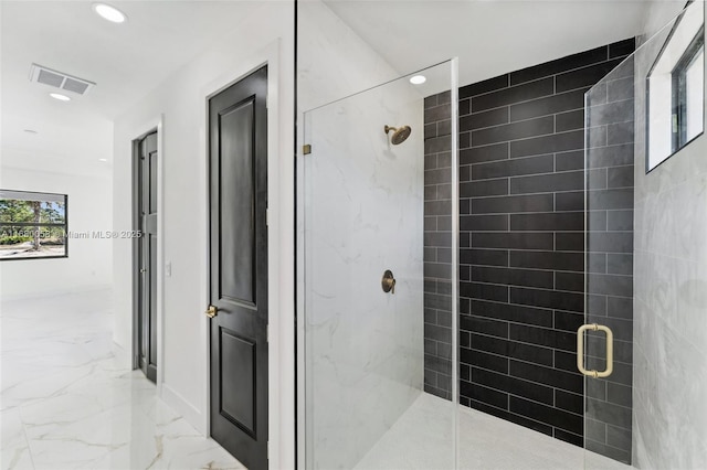 bathroom with a shower with shower door