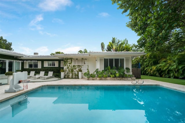 rear view of house with a patio