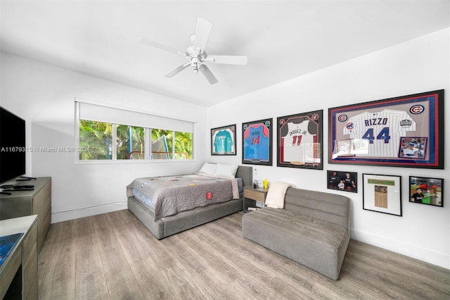 bedroom featuring ceiling fan and light hardwood / wood-style flooring