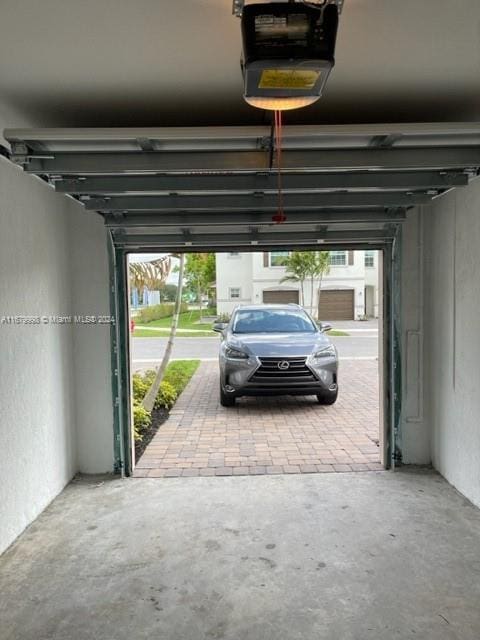 garage featuring a garage door opener