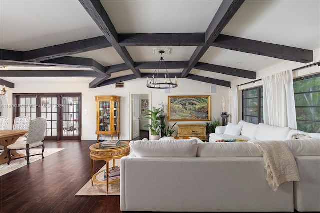 living area with a wealth of natural light, french doors, a notable chandelier, and dark wood finished floors