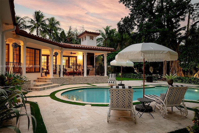 2616 Acacia Ct, Fort Lauderdale, FL 33301 - pool at dusk with a patio area, an outdoor pool, and ceiling fan