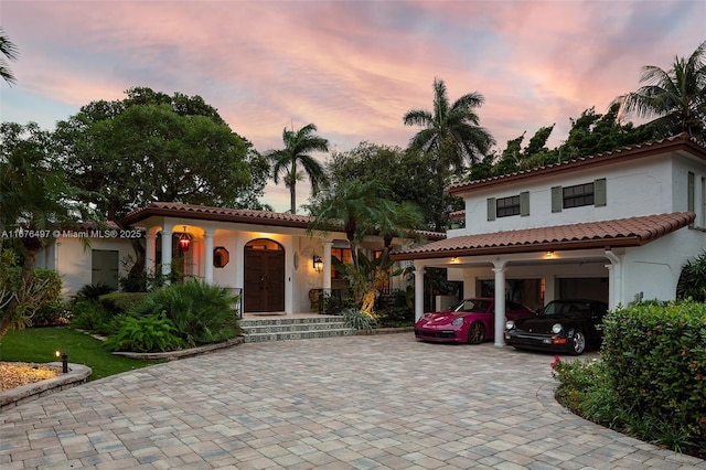 2616 Acacia Ct, Fort Lauderdale, FL 33301 - mediterranean / spanish-style home featuring decorative driveway, stucco siding, a tile roof, and a garage