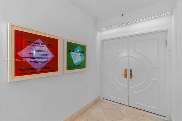 300 S Pointe Dr Unit 3204, Miami Beach, FL 33139 - hall featuring ornamental molding, baseboards, and light tile patterned floors