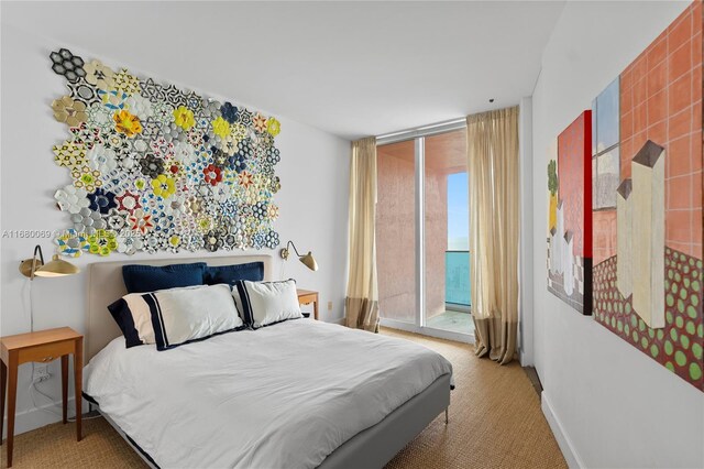 300 S Pointe Dr Unit 3204, Miami Beach, FL 33139 - bedroom with access to exterior, carpet floors, and expansive windows
