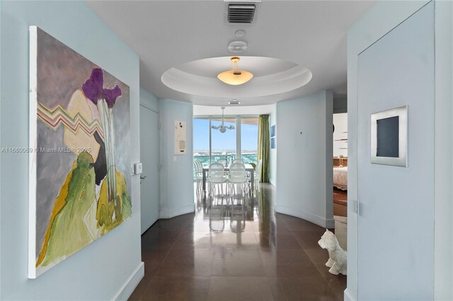 300 S Pointe Dr Unit 3204, Miami Beach, FL 33139 - corridor featuring baseboards, a chandelier, a raised ceiling, and tile patterned floors