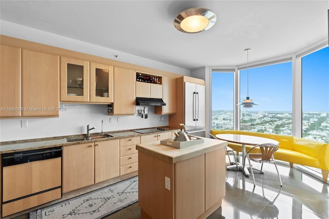 kitchen featuring sink, a kitchen island, light brown cabinetry, and dishwasher