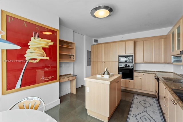 kitchen with a center island, butcher block countertops, black appliances, sink, and light brown cabinetry