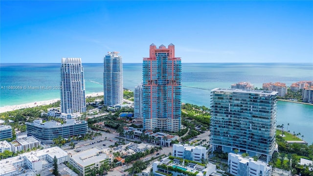 aerial view featuring a water view and a beach view