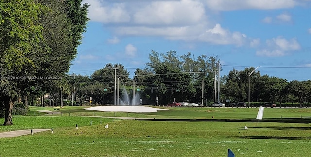 surrounding community featuring a yard