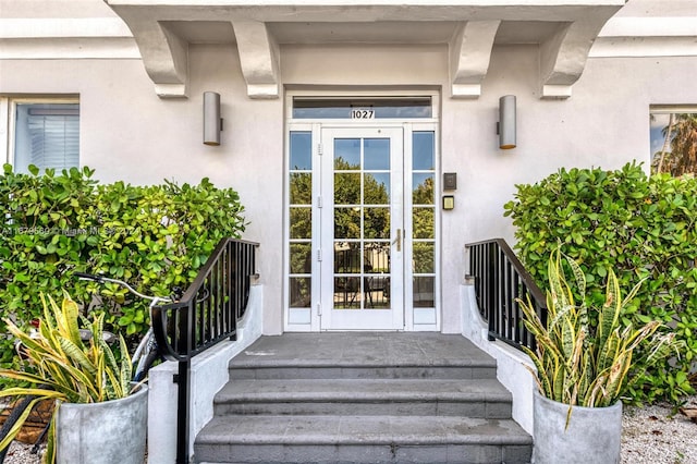 view of exterior entry featuring french doors