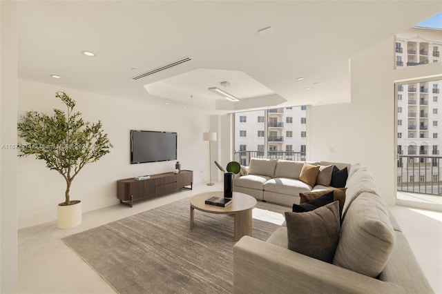 living room with a tray ceiling