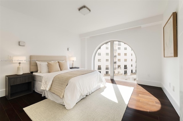 bedroom featuring dark hardwood / wood-style floors