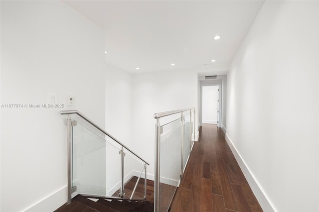55 Merrick Way Unit 808, Coral Gables, FL 33134 - hallway with an upstairs landing, recessed lighting, baseboards, and dark wood-type flooring