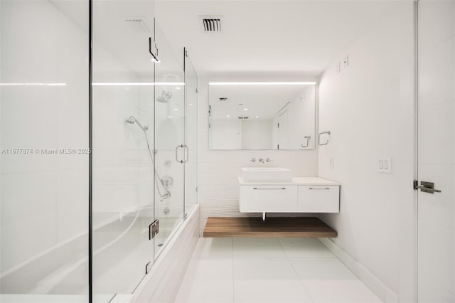 55 Merrick Way Unit 808, Coral Gables, FL 33134 - bathroom with vanity, bath / shower combo with glass door, and tile patterned flooring