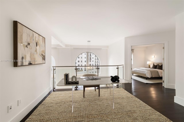 hall with dark hardwood / wood-style flooring